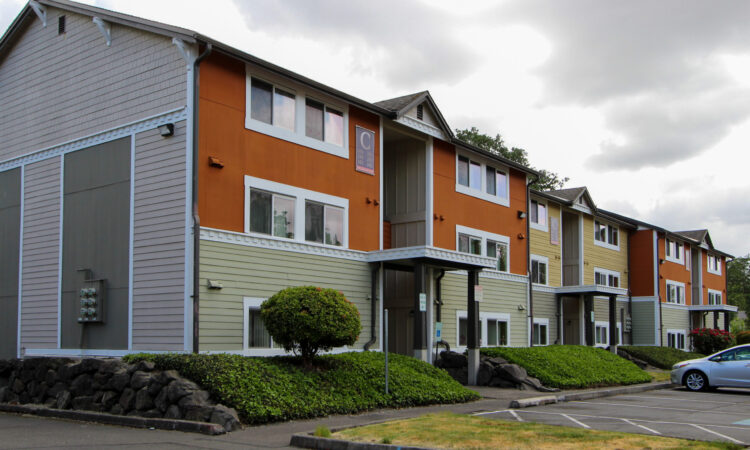 A multicolor three-story walkup.